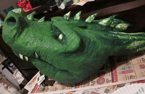 Green styrofoam dragon head prop