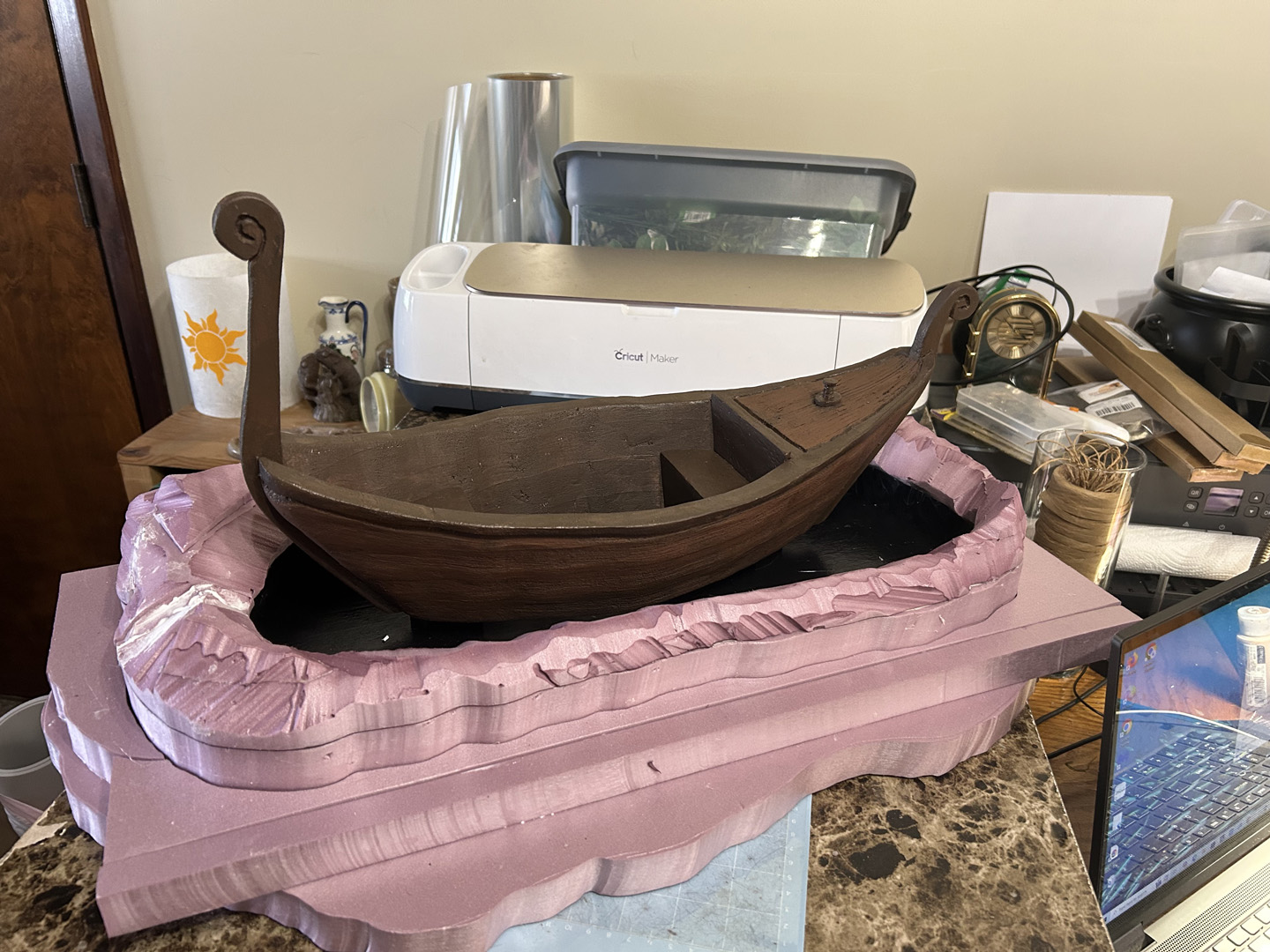 adding a display base to a small decorative boat