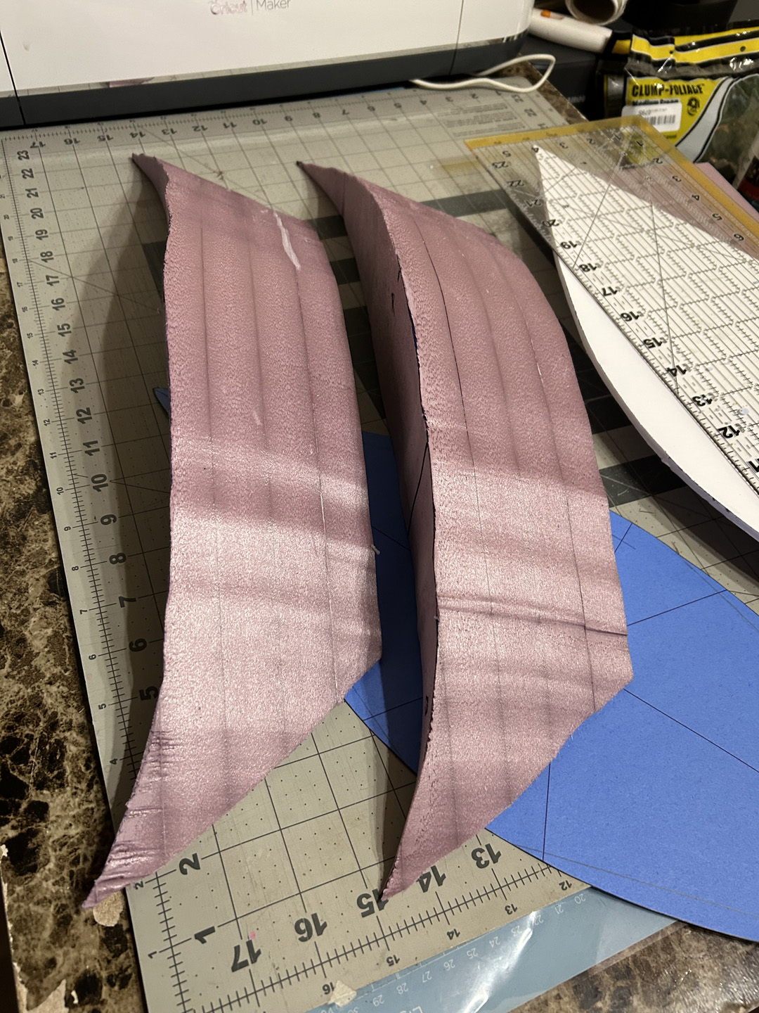 cutting a small decorative boat out of pink xps foam