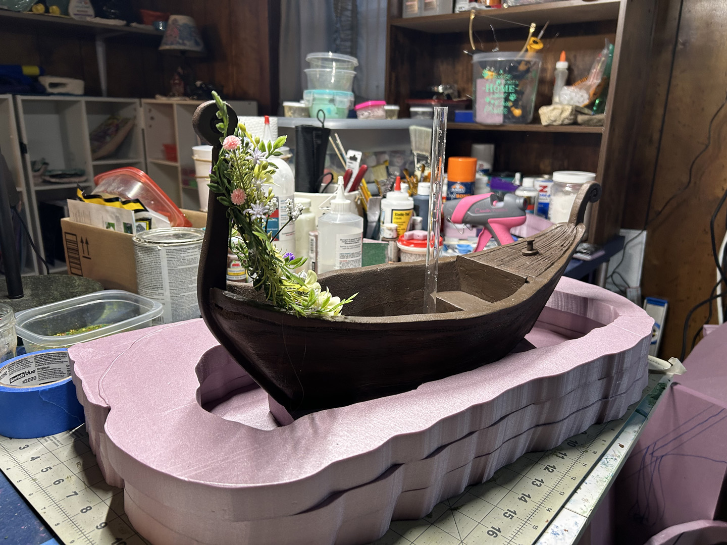 adding a display base to a small decorative boat