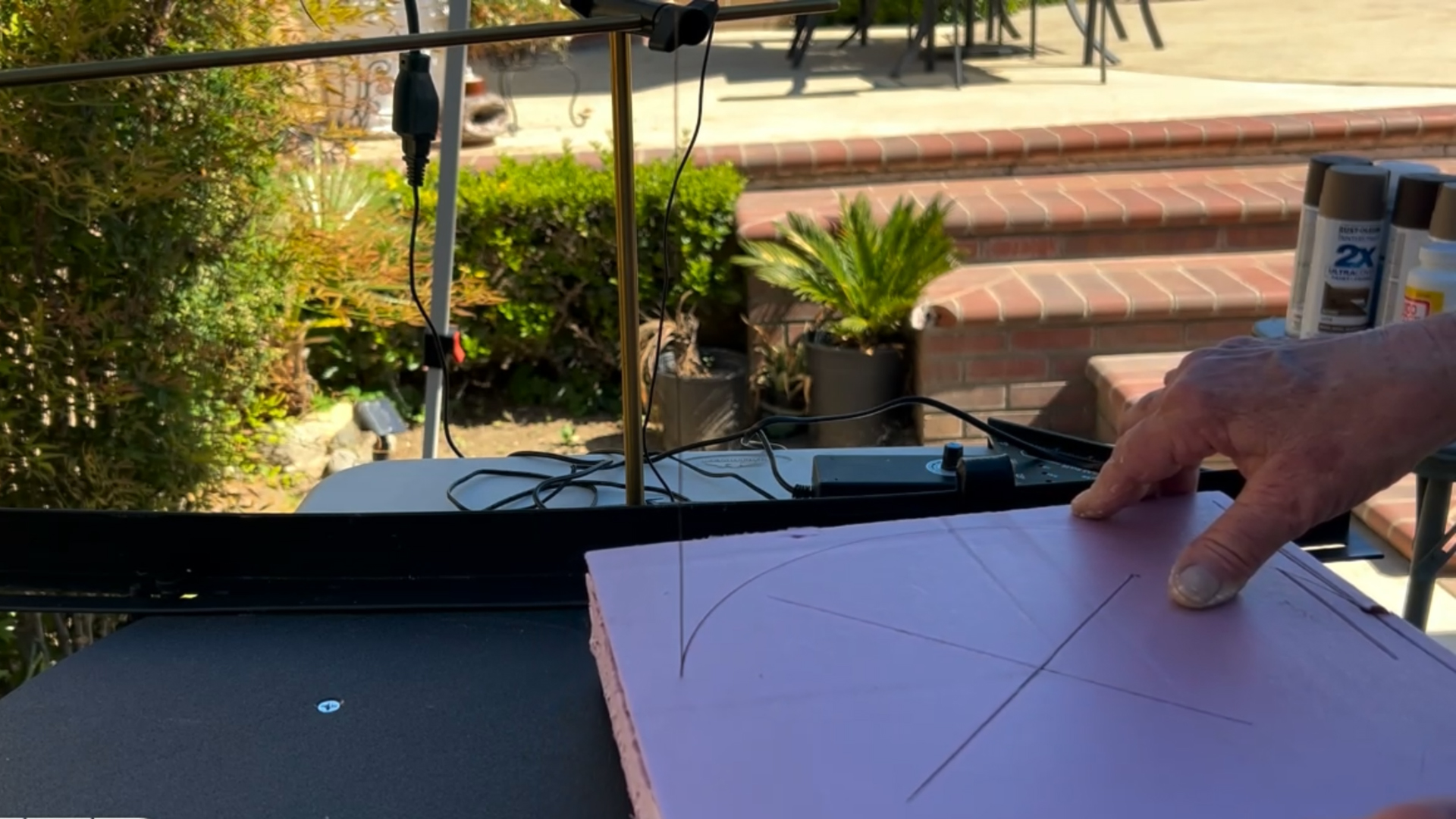 cutting a mini replica of rapunzel's tower out of pink xps foam