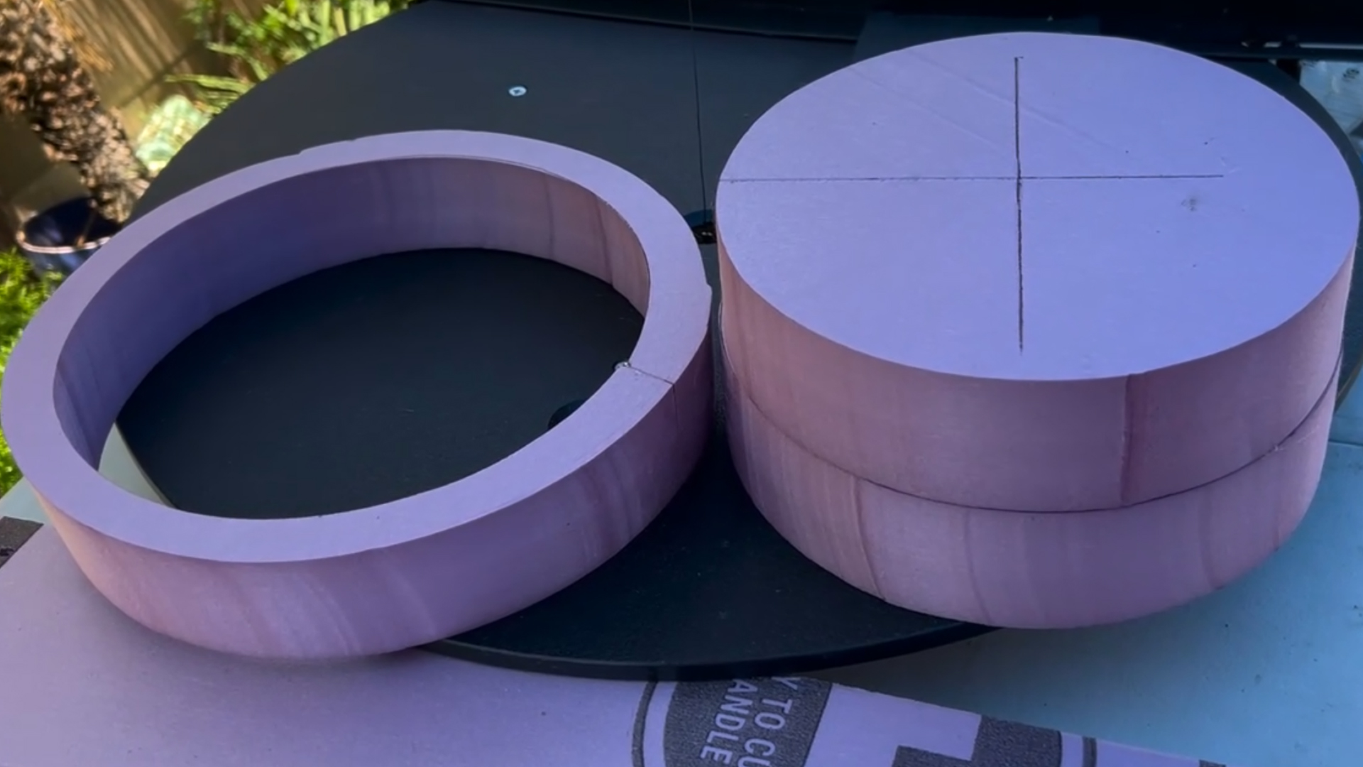 cutting a mini replica of rapunzel's tower out of pink xps foam