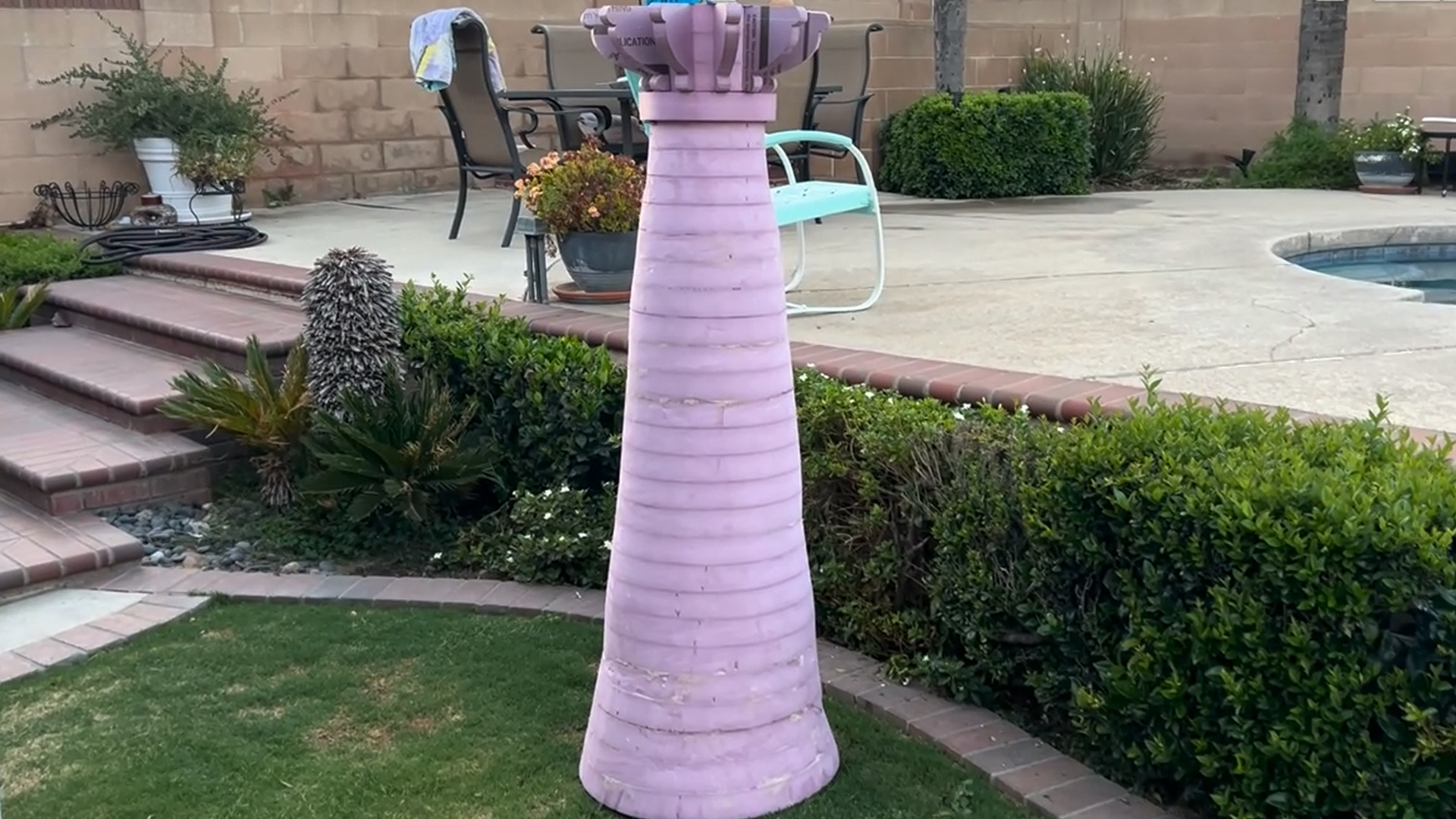 cutting a mini replica of rapunzel's tower out of pink xps foam