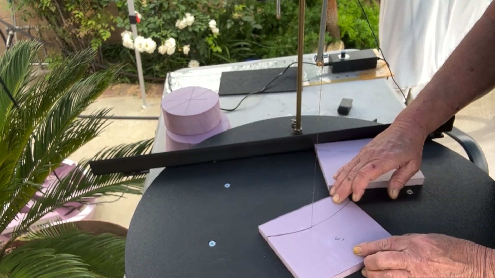 cutting out decorative pieces for a mini replica of rapunzel's tower