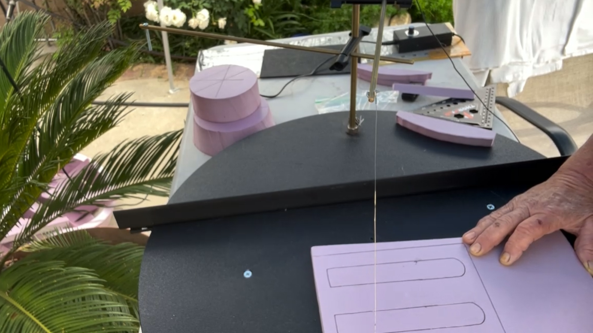 cutting out decorative pieces for a mini replica of rapunzel's tower