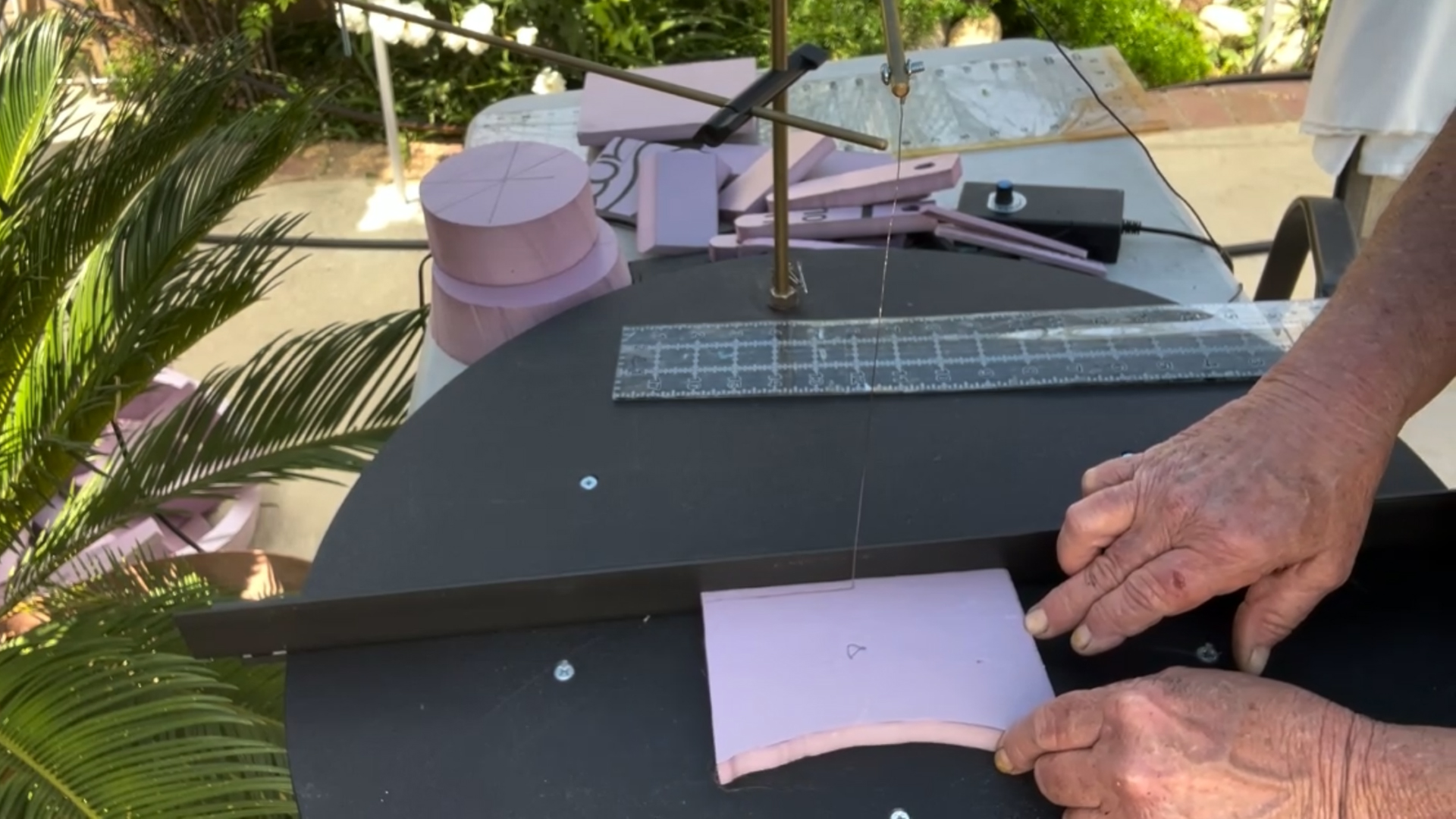cutting out decorative pieces for a mini replica of rapunzel's tower