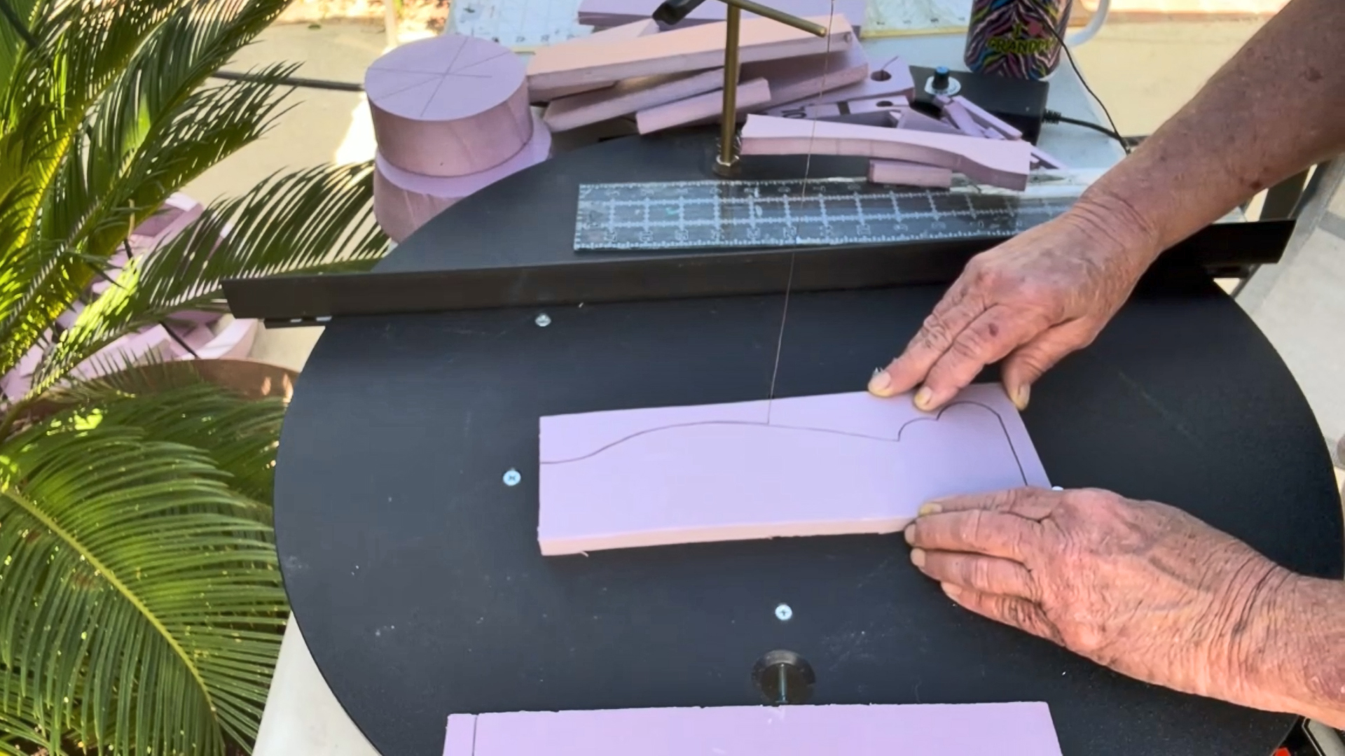 cutting out decorative pieces for a mini replica of rapunzel's tower