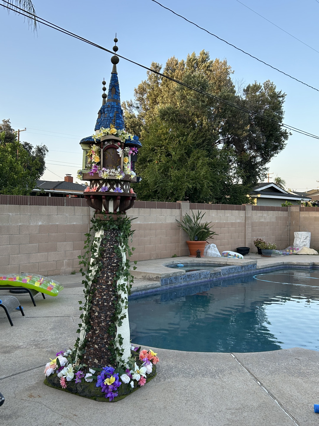 a mini replica of rapunzel's tower made out of xps foam for photo ops