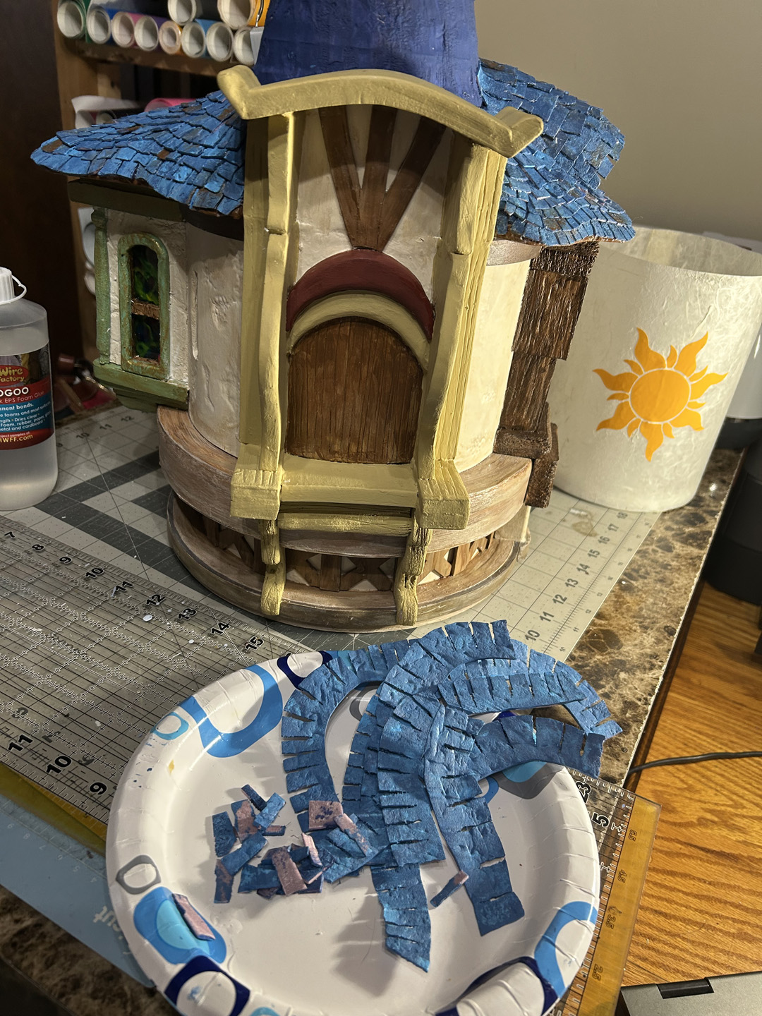 painting a mini replica of rapunzel's tower