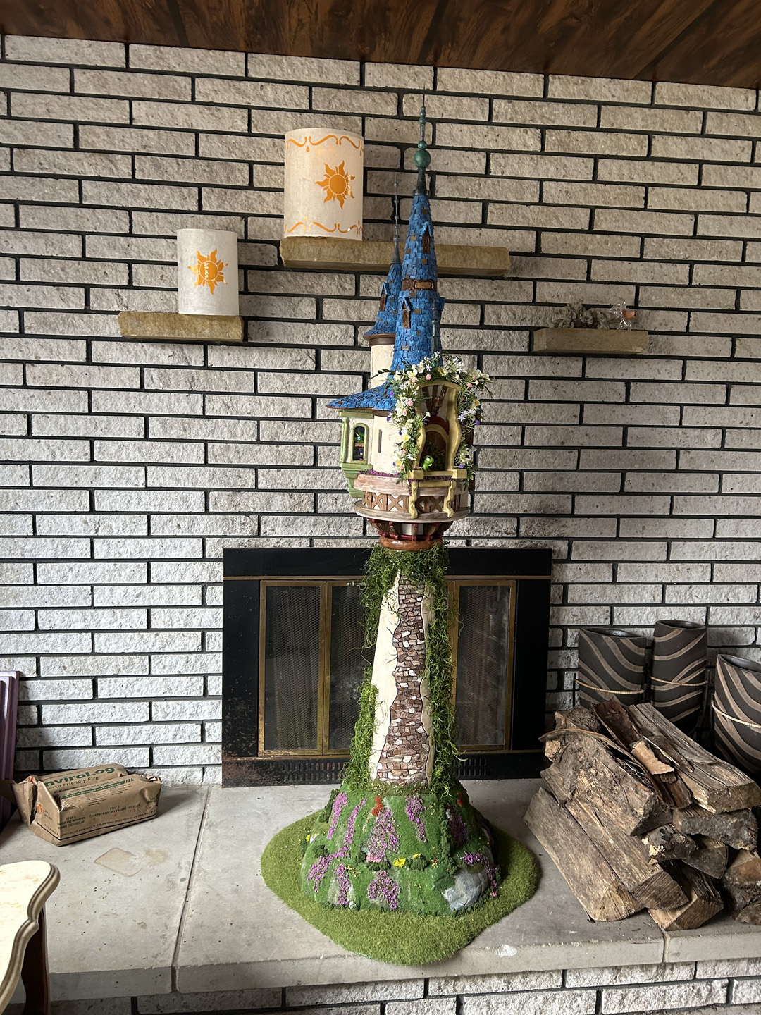 a mini replica of rapunzel's tower made out of pink xps foam