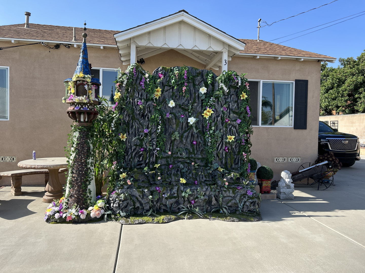 rapunzel's tower from tangled and a faux stone backdrop made out of foam for party photo ops