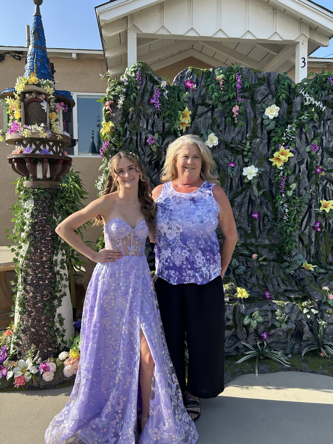 rapunzel's tower from tangled and a faux stone backdrop made out of foam for party photo ops